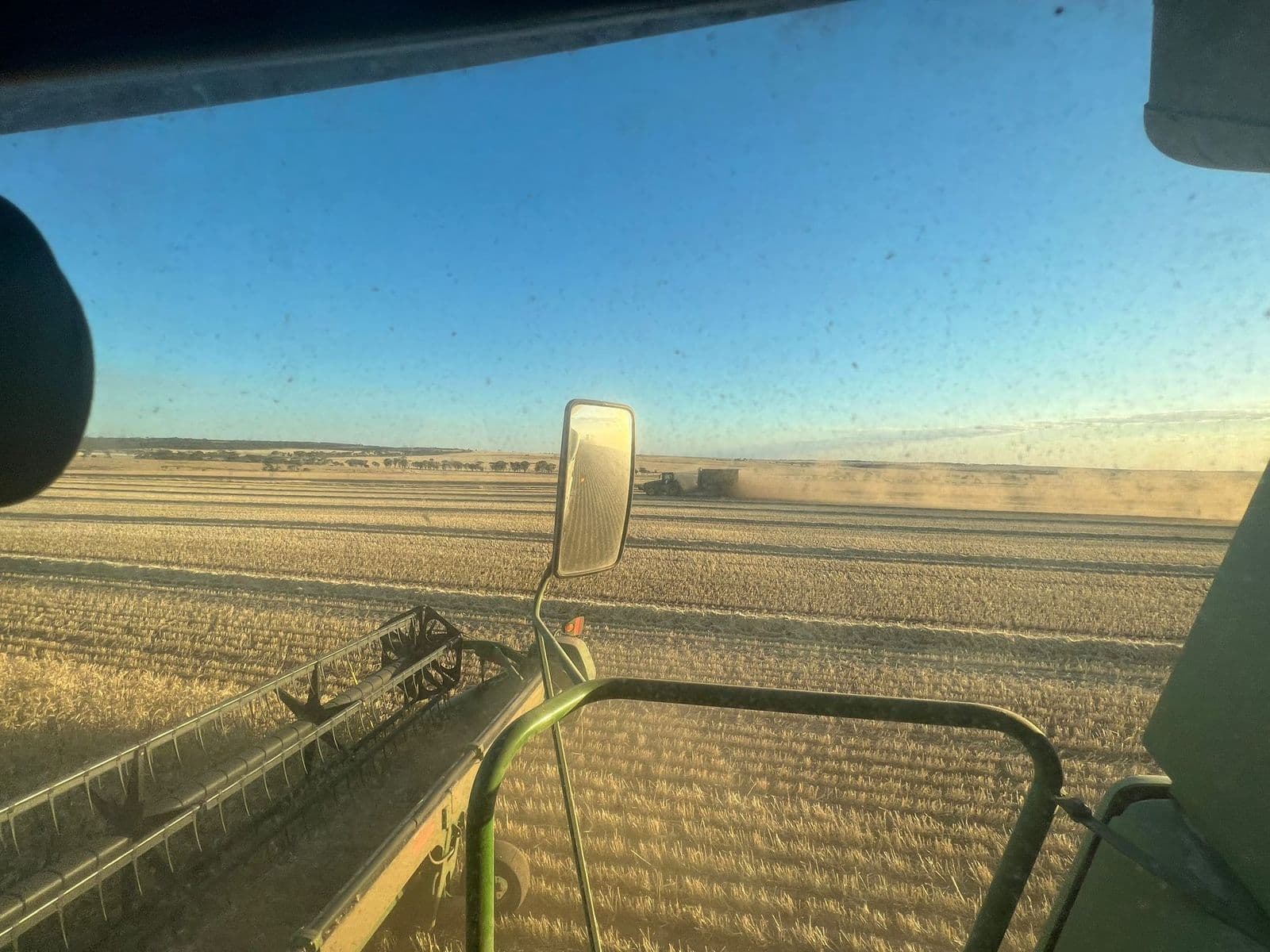 View from inside a machine cab over a paddock in Western Australia